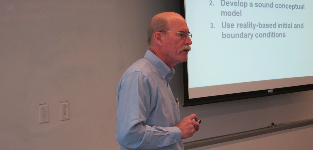 Pete Shanahan discusses modeling fundamentals with U.S. NRC staff at the 2015 training course.